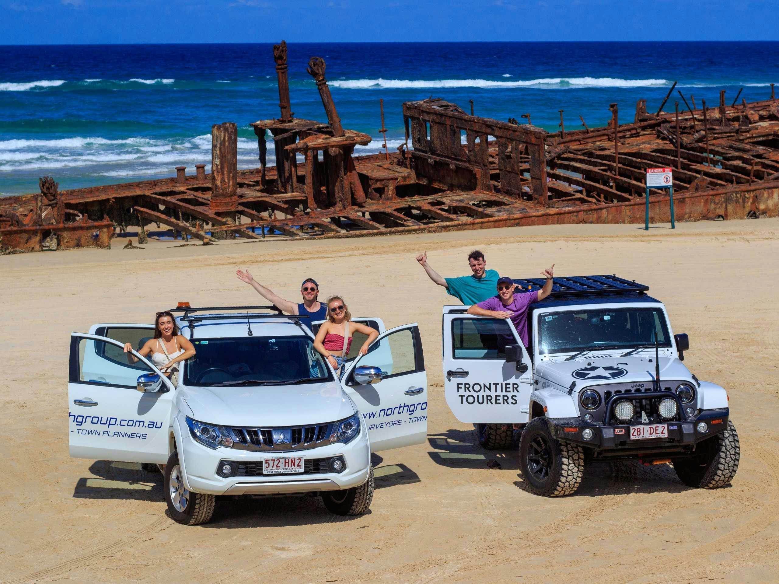 Andrew and his friends driving on the sand in Fraser Island