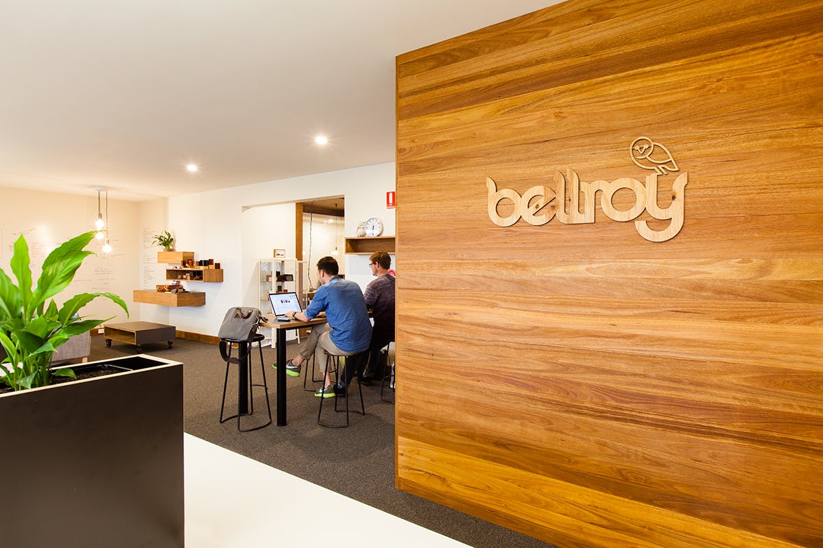 Bellroy's office in Bells Beach, with wooden sign and people working