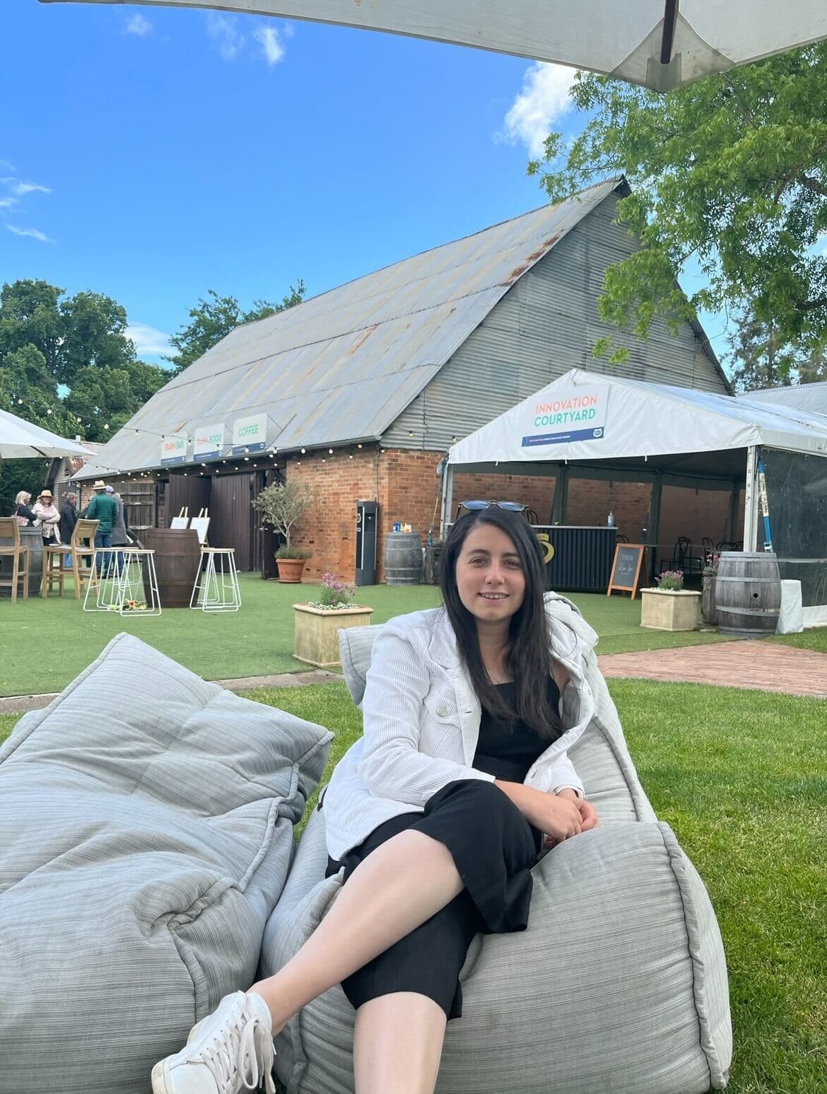 Woman sitting on a bean bag on a sunny day