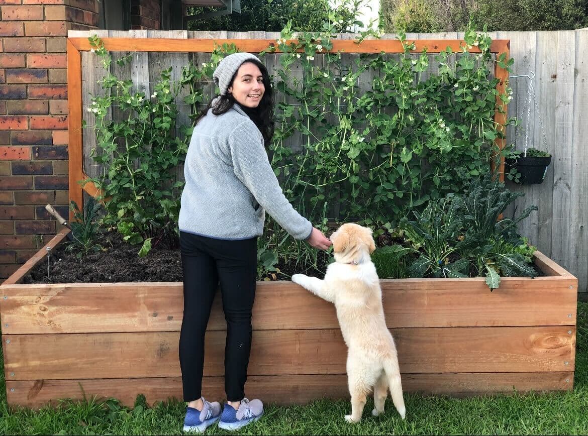 Women standing in the garden with a puppy