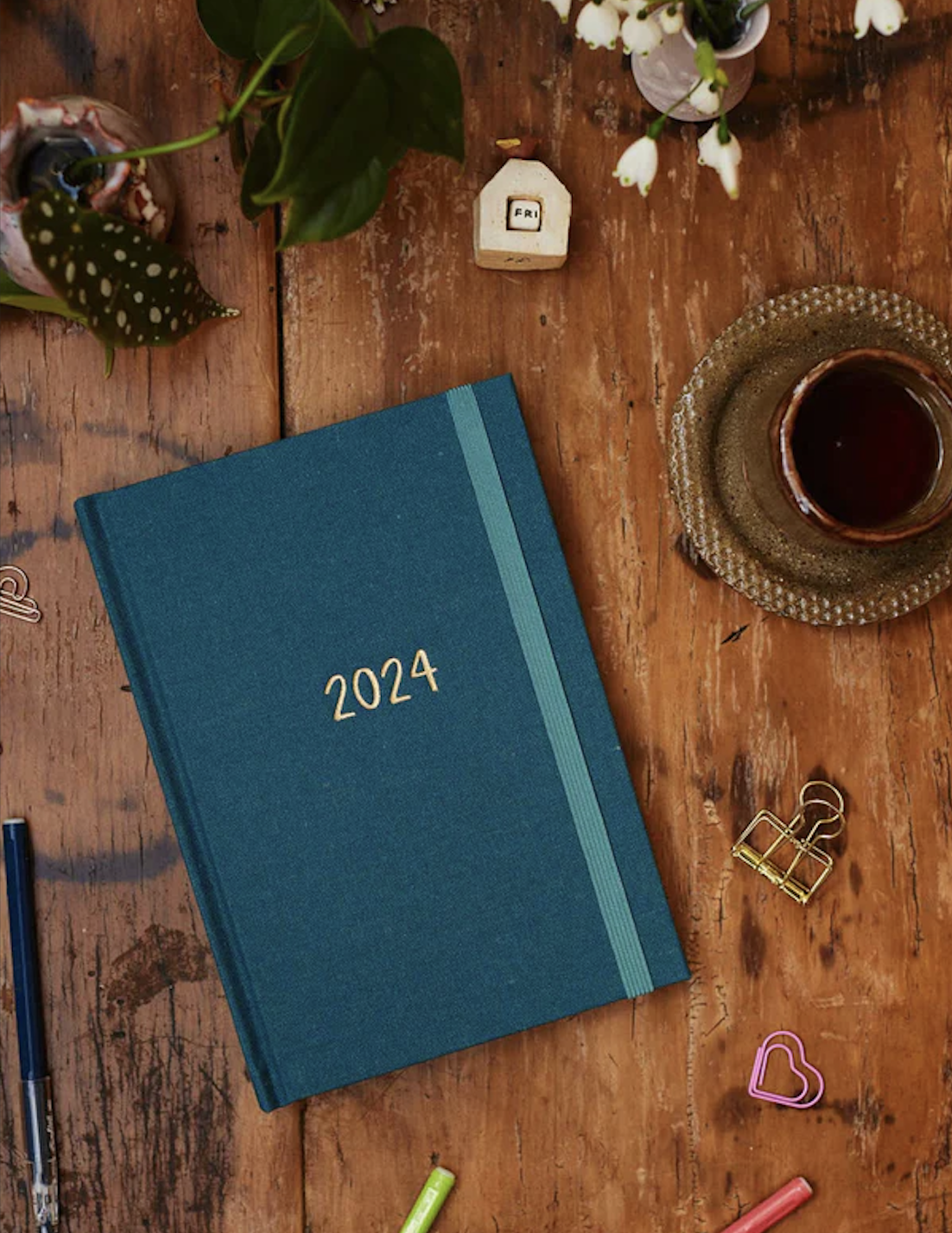 2024 planner book in teal with gold numbering